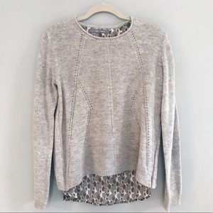Light grey knit sweater with fabric underlay